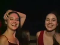 Incest twins kisses each other on a party